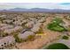 Aerial view showcasing the community location near the golf course and surrounding landscape at 704 Peachy Canyon Cir # 101, Las Vegas, NV 89144