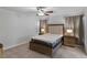 Bedroom featuring a ceiling fan, a comfortable bed, and natural light from the windows at 7462 Dragonfruit Ave, Las Vegas, NV 89113