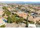 Overhead shot showcasing a neighborhood with well-maintained homes and lush landscaping at 77 Chapman Heights St, Las Vegas, NV 89138