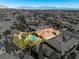 Aerial image of a property highlighting its pool, mature landscaping and neighborhood at 77 Chapman Heights St, Las Vegas, NV 89138