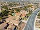 Aerial view of a luxury home with a pool in an upscale residential neighborhood at 77 Chapman Heights St, Las Vegas, NV 89138