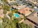 Aerial shot of a house showcasing a well-maintained pool, putting green and lush backyard at 77 Chapman Heights St, Las Vegas, NV 89138