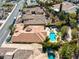 Real estate aerial showcasing property with a pool, putting green, and lush backyard at 77 Chapman Heights St, Las Vegas, NV 89138