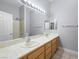 Bathroom featuring double sinks, framed mirrors and large vanity at 77 Chapman Heights St, Las Vegas, NV 89138