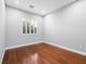 Neutral bedroom with window, hardwood floors, and white trim at 77 Chapman Heights St, Las Vegas, NV 89138