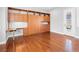 Bedroom with hardwood floors, built-in cabinets and shelving, and a murphy bed at 77 Chapman Heights St, Las Vegas, NV 89138