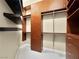 Custom walk-in closet with built-in shelving, drawers, and hanging rods at 77 Chapman Heights St, Las Vegas, NV 89138