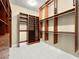 Custom walk-in closet with built-in shelving, drawers, and ample storage at 77 Chapman Heights St, Las Vegas, NV 89138