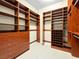 Spacious walk-in closet featuring custom shelving, drawers, and hanging spaces at 77 Chapman Heights St, Las Vegas, NV 89138