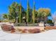 Landscaped Encanto community entrance with lush plantings and stone accents at 77 Chapman Heights St, Las Vegas, NV 89138