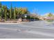 Inviting Encanto community entrance featuring manicured landscaping and decorative signage at 77 Chapman Heights St, Las Vegas, NV 89138