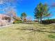 Picturesque community park features walking paths and covered gazebo amidst mature trees at 77 Chapman Heights St, Las Vegas, NV 89138