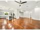 Spacious open-concept living room flowing into the kitchen with hardwood floors and modern lighting at 77 Chapman Heights St, Las Vegas, NV 89138