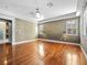 Spacious bedroom featuring hardwood floors, white shutters, and designer lighting at 77 Chapman Heights St, Las Vegas, NV 89138