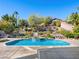 Beautiful backyard pool area surrounded by lush greenery at 77 Chapman Heights St, Las Vegas, NV 89138