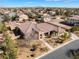 Expansive single-story home featuring desert landscaping, tile roof, and proximity to mountains in a bright, sunny locale at 7860 Thunder Echo St, Las Vegas, NV 89131