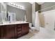 Bathroom featuring double vanity, medicine cabinet, and combination tub and shower at 7860 Thunder Echo St, Las Vegas, NV 89131