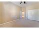 Large carpeted bedroom featuring a ceiling fan and closet at 7860 Thunder Echo St, Las Vegas, NV 89131