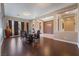 Open-concept dining room with hardwood floors, decorative columns and abundant natural light for a spacious feel at 7860 Thunder Echo St, Las Vegas, NV 89131