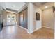 Elegant foyer with neutral paint, tile flooring, and decorative wall art at 7860 Thunder Echo St, Las Vegas, NV 89131