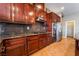 Kitchen with stainless steel appliances, granite countertops, and dark wood cabinetry at 7860 Thunder Echo St, Las Vegas, NV 89131