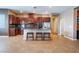 Spacious kitchen featuring stainless appliances, a large island, and dark wood cabinets at 7860 Thunder Echo St, Las Vegas, NV 89131