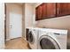 Modern laundry room with front loading washer and dryer at 7860 Thunder Echo St, Las Vegas, NV 89131