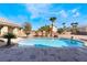 Backyard with pool, landscaping, and views of the surrounding homes at 7860 Thunder Echo St, Las Vegas, NV 89131