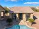 Pool house with a covered entrance, complemented by a paved walkway and desert plants at 7860 Thunder Echo St, Las Vegas, NV 89131