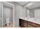 Bathroom features tile floors, double sink vanity, and toilet at 7870 Formitch Ct, Las Vegas, NV 89166