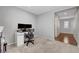 Modern home office featuring neutral walls, plush carpeting, and a sleek white desk setup for productivity at 7870 Formitch Ct, Las Vegas, NV 89166