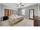 Bedroom features neutral paint, carpet floors, ceiling fan, and a decorative headboard at 7870 Formitch Ct, Las Vegas, NV 89166