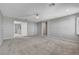 Bright, open bedroom featuring plush carpeting, neutral walls, and bright windows with a ceiling fan fixture at 7870 Formitch Ct, Las Vegas, NV 89166