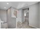 Hallway landing with laundry closet access, neutral walls, and soft carpeting - blending practicality and comfort at 7870 Formitch Ct, Las Vegas, NV 89166