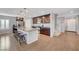 Spacious kitchen featuring an island, granite countertops, stainless steel appliances, and hardwood floors at 7870 Formitch Ct, Las Vegas, NV 89166