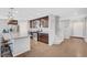 Beautiful kitchen featuring a granite island, stainless steel appliances, and a view of the home's entryway at 7870 Formitch Ct, Las Vegas, NV 89166