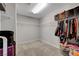 Spacious walk-in closet with ample shelving and carpet floors at 7870 Formitch Ct, Las Vegas, NV 89166