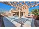 Backyard patio featuring an open air area, pergola, and a balcony above overlooking the yard at 8429 Spirit Vale Ave, Las Vegas, NV 89117