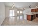 Open-concept kitchen featuring granite countertops, tile floors, and stainless steel appliances at 8429 Spirit Vale Ave, Las Vegas, NV 89117