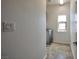 Convenient laundry room with a washer and a small window for natural light at 8429 Spirit Vale Ave, Las Vegas, NV 89117