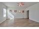 Bright main bedroom features wood floors, ceiling fan, and natural lighting at 8429 Spirit Vale Ave, Las Vegas, NV 89117