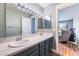 Bathroom with double sinks, and vanity with modern lighting at 8452 Boseck Dr # 285, Las Vegas, NV 89145