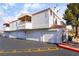 Exterior of townhomes with attached garages and balconies at 8452 Boseck Dr # 285, Las Vegas, NV 89145