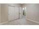 A clean bedroom featuring large closet and a view into an adjacent bathroom at 8605 Wild Diamond Ave, Las Vegas, NV 89143