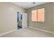 Cozy bedroom with carpet and an attached bathroom visible through the open door at 8605 Wild Diamond Ave, Las Vegas, NV 89143