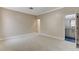 Large carpeted bedroom with access to another room with a full bath at 8605 Wild Diamond Ave, Las Vegas, NV 89143