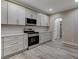 Beautiful kitchen featuring modern appliances, ample counter space, and white cabinets at 8605 Wild Diamond Ave, Las Vegas, NV 89143