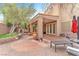 Expansive backyard with a covered patio, built-in spa, and lush landscaping at 8629 Estrelita Dr, Las Vegas, NV 89128
