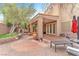 Backyard patio with seating area, outdoor kitchen and a hot tub at 8629 Estrelita Dr, Las Vegas, NV 89128