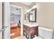 Bathroom vanity and toilet with bedroom in the background at 8629 Estrelita Dr, Las Vegas, NV 89128
